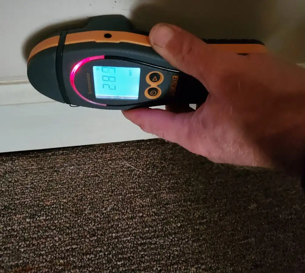 Moisture detection at baseboard during Storm Damage Restoration in West Pennsboro